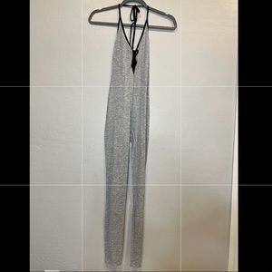 Grey jumpsuit with open back.